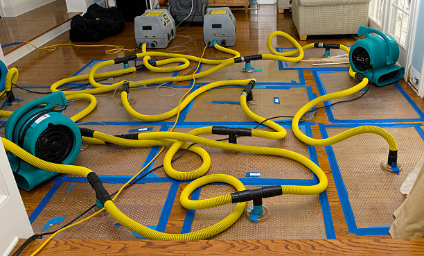 Professional Flood Damage Restoration technician working in Goffstown, NH